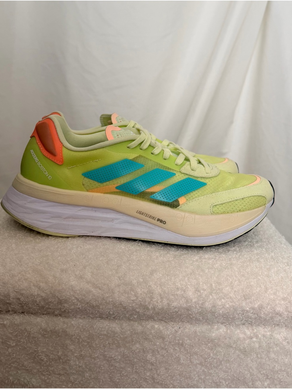 Adidas Adizero Boston 10 sneakers in the "Almost Lime Mint Rush"